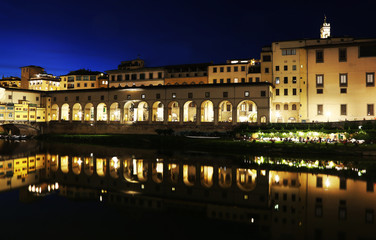 Fototapeta na wymiar night landscape of Florence or Firenze city and the Arno river Italy