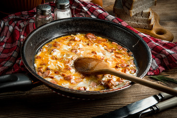 Scrambled eggs with sausage.