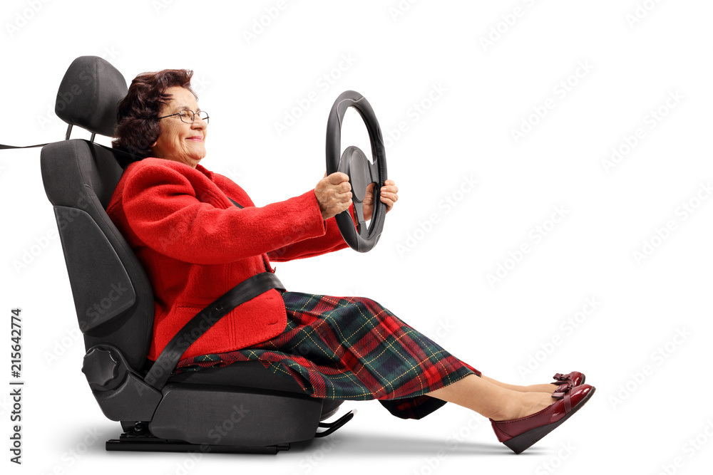 Poster mature woman seated in a car seat driving