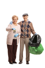 Elderly couple with a tin can and a garbage bag