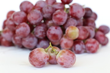 Bunch of grapes over white background