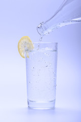 Cold fresh water in glass with lemon