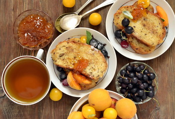 French toast with fresh berries and jam, top view