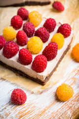 Fresh raspberry cheesecake on the rustic background. Selective focus. Shallow depth of field.