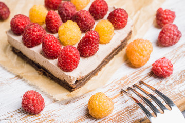 Fresh raspberry cheesecake on the rustic background. Selective focus. Shallow depth of field.
