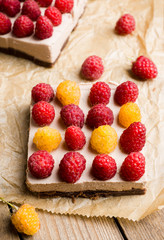 Fresh raspberry cheesecake on the rustic background. Selective focus. Shallow depth of field.