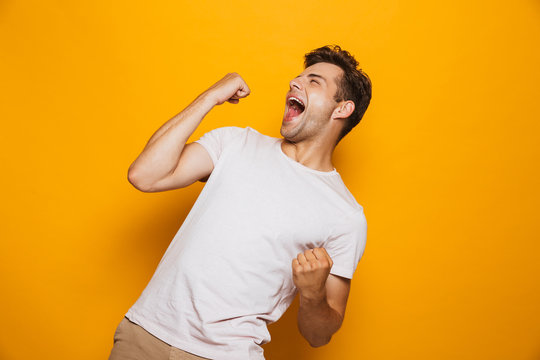 Portrait Of A Joyful Young Man Celebrating