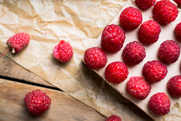 Fresh raspberry cheesecake on the rustic background. Selective focus. Shallow depth of field.