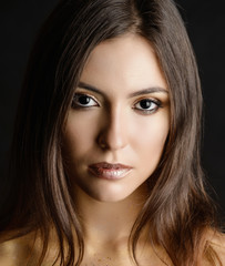 Woman with total black eyes. Studio shot.