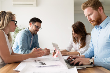Fototapeta premium Team of young architects discussing about project
