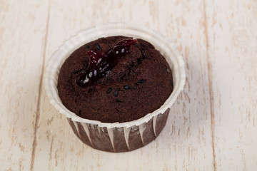 Tasty muffin over wooden