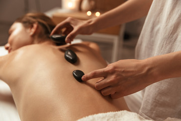 Relaxed girl enjoying body treatment