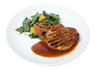 Grilled pork fillet with spinach salad.