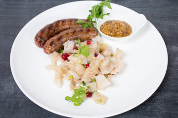 Grilled sausages with sauerkraut.