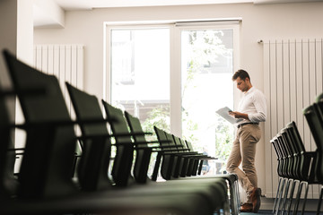 Portrait of a concentrated handsome formal dressed man