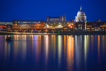 Fototapeta na wymiar Long exposure, London riverside cityscape with St Paul's Cathedral