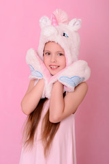 l little girl in a hat with a unikorn