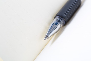 Closeup of note book and pen