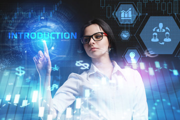 The concept of business, technology, the Internet and the network. A young entrepreneur working on a virtual screen of the future and sees the inscription: introduction