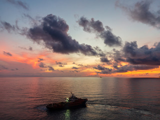 Offshore oil and gas crew boat approach to the platform for transfer passenger between crew boat...