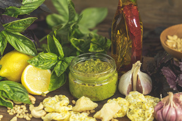 Fresh homemade pesto sauce close up and food ingredients