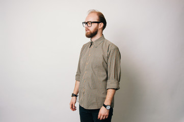 Portrait of young bearded man wearing glasses