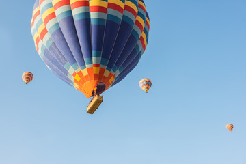 Bright colorful balloons against the blue sky.
