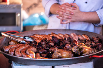 Fried sausages in a metal dish