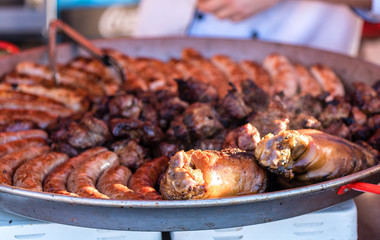 Fried sausages in a metal dish