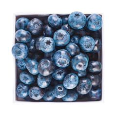 Fresh blueberries and leaves, berry frame isolated on white background, top view