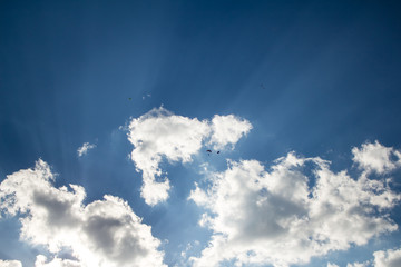 blue sky and heavy, white clouds