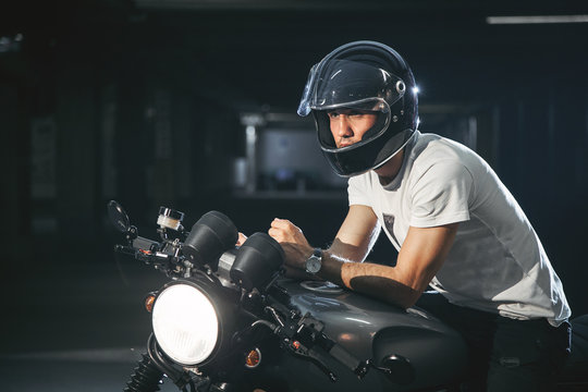 Portrait Of A Motorcyclist In A Helmet On A Motorcycle.