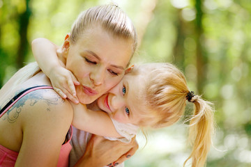 Love and happiness. Mother and daughter kissing and hugging. Family, Bonding, Childhood, Parenting