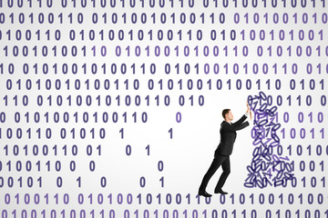 Businessman pushing binary code