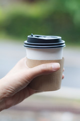 Hand with hot coffee