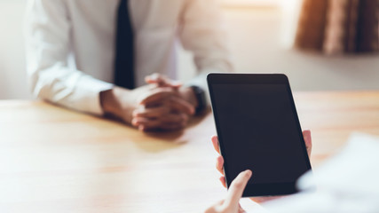 Businessman working on tablet design ideas. Concept of modern business. Vintage tone.