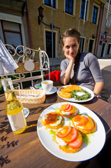 Young woman and traditional potato pancakes, Polish