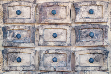 Weathered wooden cabinet with small drawers