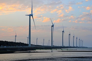 Wind Turbines on the beach at sunset in Gaomei wetland, Taichung, Taiwan