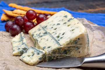 Blue cheese made from cow milk with Penicillinum mold, tasty soft cheese with specific odor