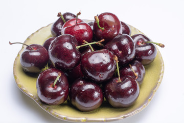 Giant fresh ripe black cherries, new harvest, ready to eat close up