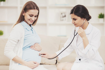 Pregnant Young Girl with Gynecologist in Hospital.