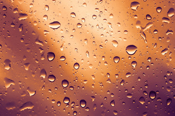 Water drops background.View through the window of strong rainy day ,Shallow depth of field composition and color toned.