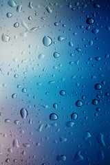 Water drops background.View through the window of strong rainy day ,Shallow depth of field composition and color toned.