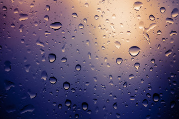 Water drops background.View through the window of strong rainy day ,Shallow depth of field composition and color toned.