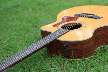 Acoustic guitar on the grass