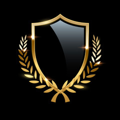 Obraz premium Black glass shield with golden frame and golden laurel wreath isolated on black background. Vector design element.