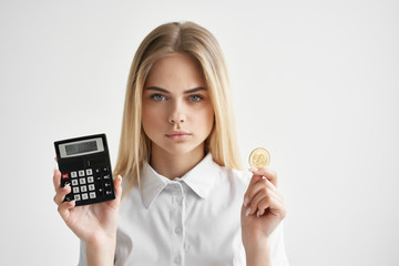business woman with a bitcoin calculator