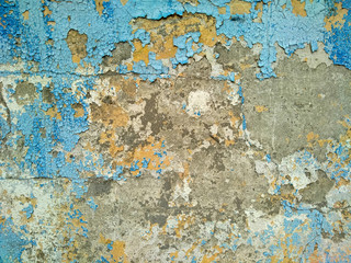 old wall. peeled. blue. yellow. texture. background.