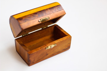 Wooden chest close up, selective focus, white background